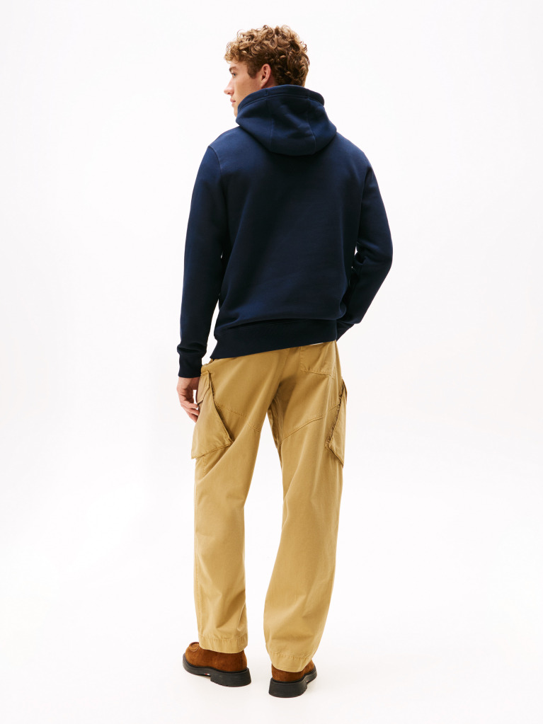 Blue Perfect for fighting the cold, this warm hoodie is enhanced with a stylish, tonal Tommy Hilfiger logo and crafted from high-quality interlock knit.  Men