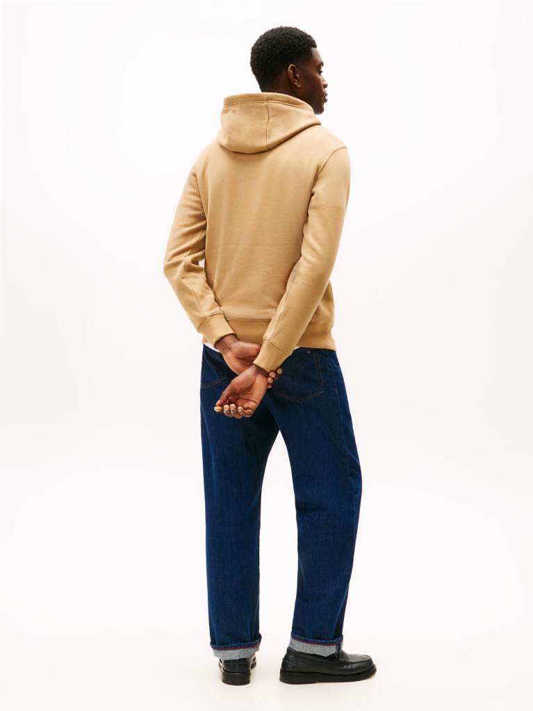Brown Perfect for fighting the cold, this warm hoodie is enhanced with a stylish, tonal Tommy Hilfiger logo and crafted from high-quality interlock knit.  Men